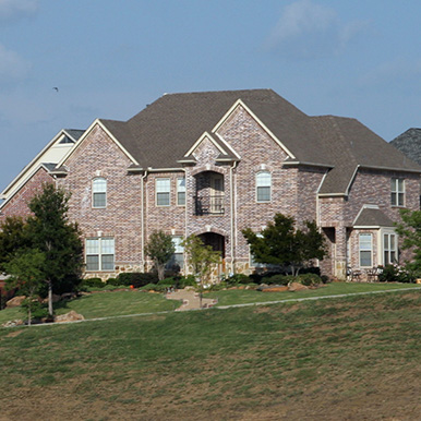 Exterior of brick home in Flower Mound by Platinum Painting